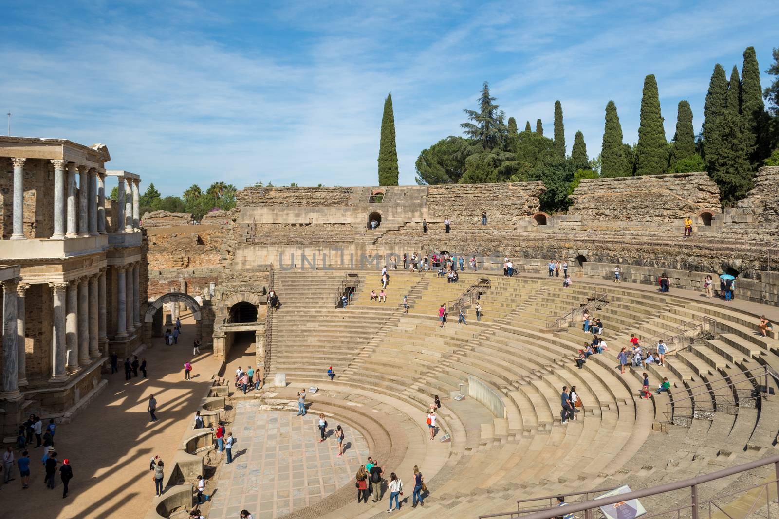 tourists visiting the Roman ruins theatre arena & waiting rooms used for gladiator & animal fights in Merida, Spain by kb79