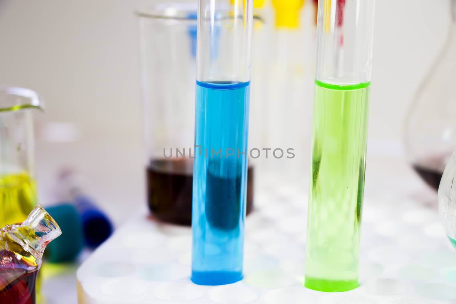 Laboratory chemical liquid elements and research diagnoses, instruments and objects in the sterile table, glassware by Taidundua