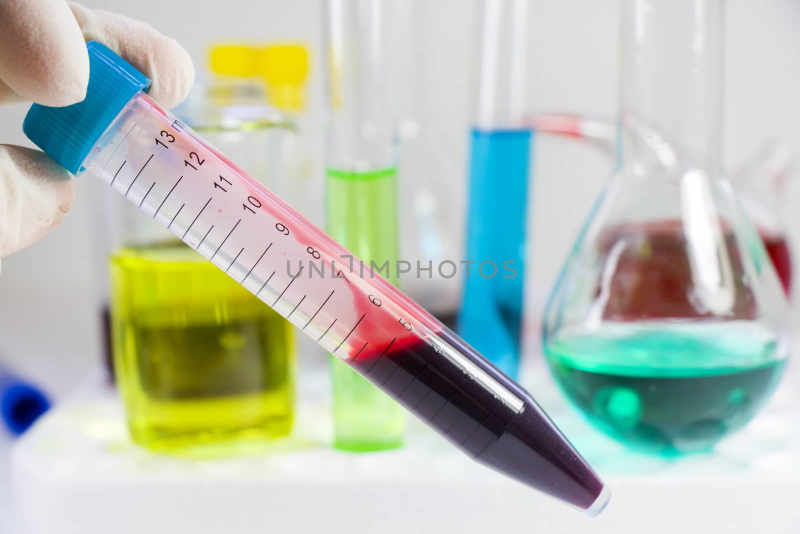 Blood test tube sample without name, empty space for text, laboratory background, copy paste.