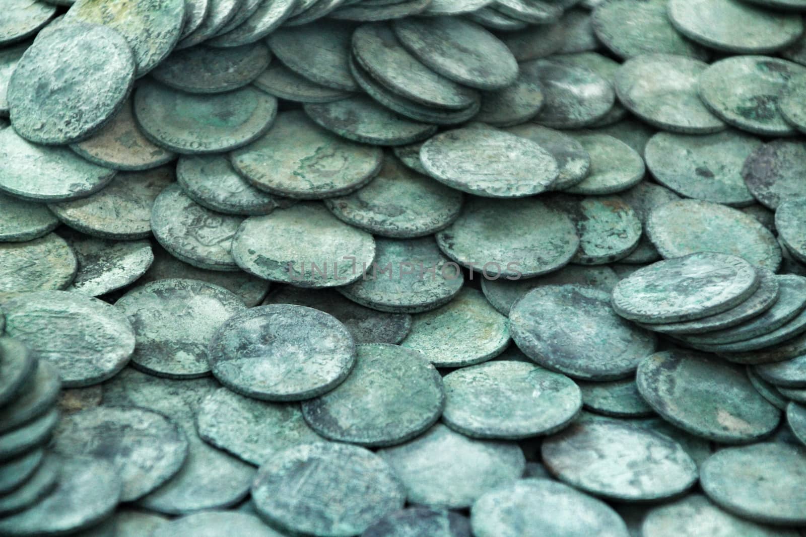 Cartagena, Murcia, Spain- July 25, 2019: Spanish silver coins recovered from the ocean floor by the Odissey company and exposed in underwater museum in Cartagena, Spain