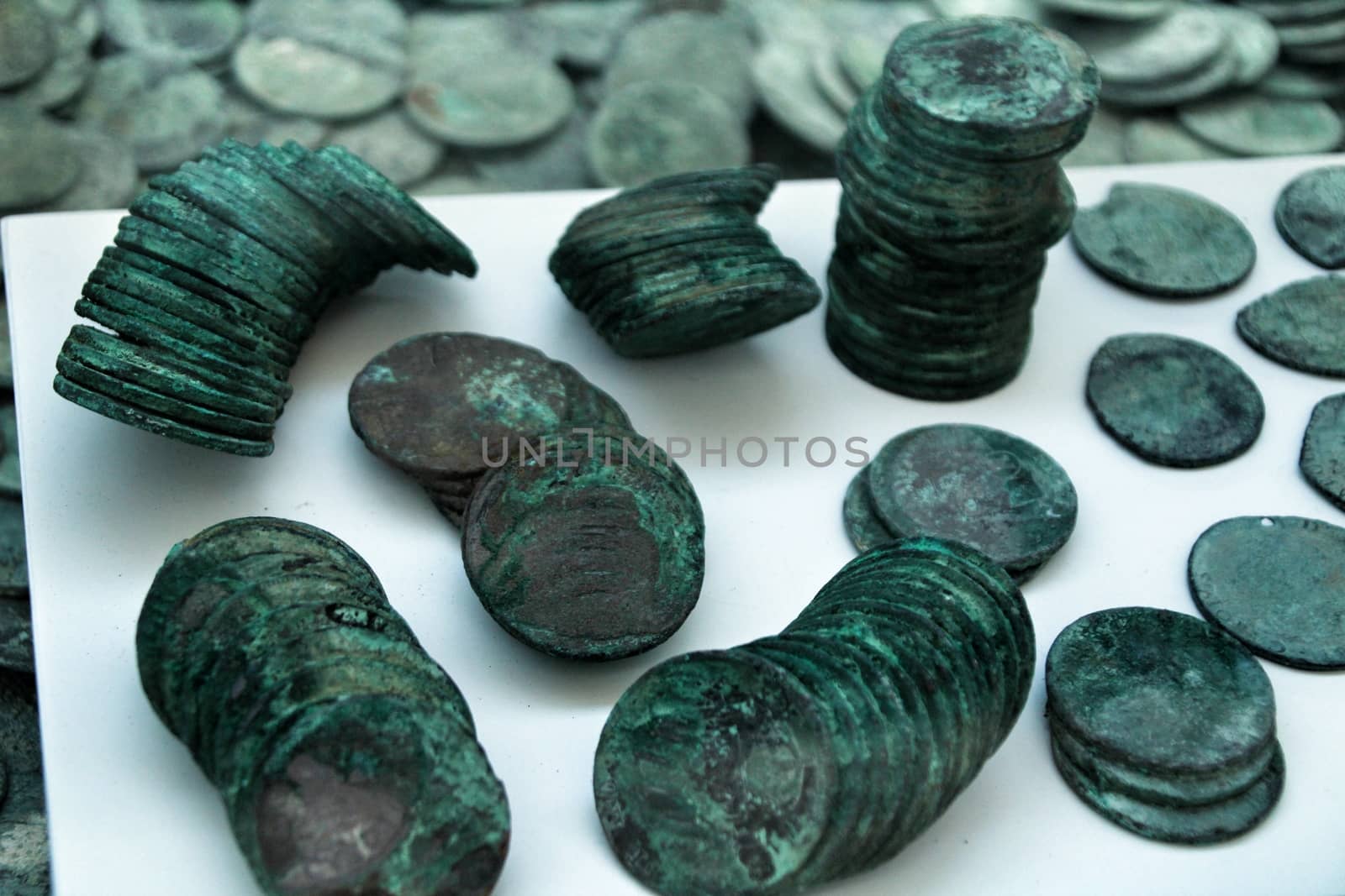 Cartagena, Murcia, Spain- July 25, 2019: Spanish silver coins recovered from the ocean floor by the Odissey company and exposed in underwater museum in Cartagena, Spain