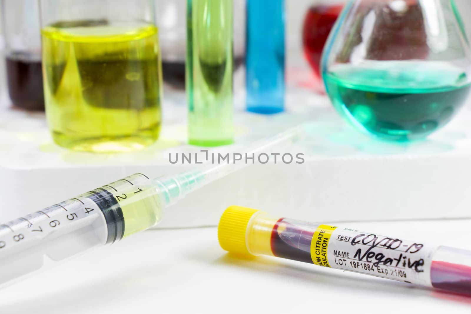 Covid - 19, coronavirus, covid blood test tube sample, laboratory diagnosis. Sars viruses and needle with vaccine by Taidundua