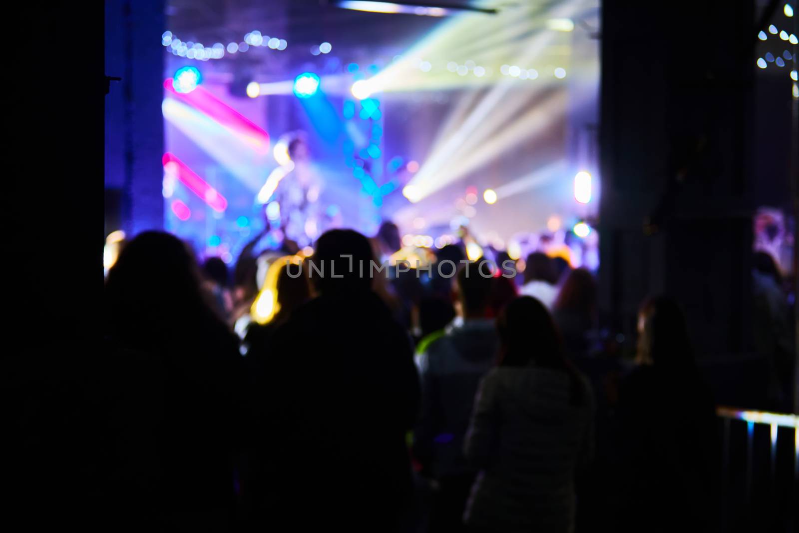 people having fun in a disco. blur effect for an artistic touch.