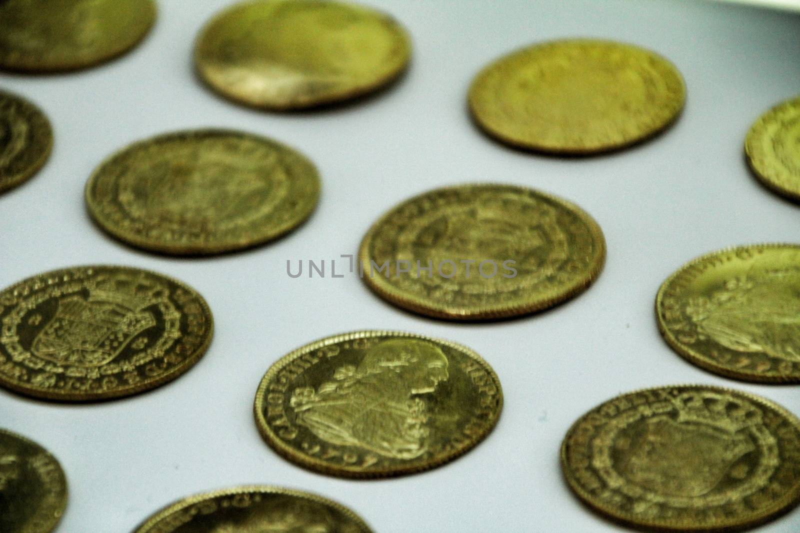 Cartagena, Murcia, Spain- July 25, 2019: Spanish gold coins recovered from the ocean floor by the Odissey company and exposed in underwater museum in Cartagena, Spain