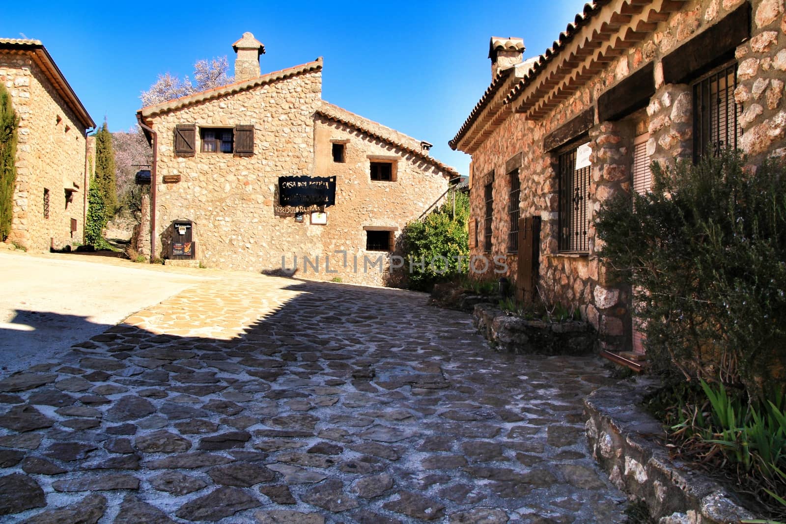 Riopar Viejo, Albacete, Spain- February 8, 2019: Old beautiful stone facades and streets in Riopar Viejo village, Castilla La Mancha, Spain. Sunny day of winter.