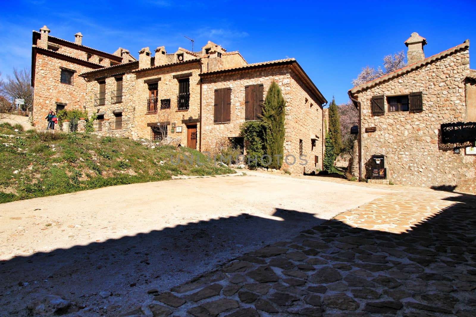 Riopar Viejo, Albacete, Spain- February 8, 2019: Old beautiful stone facades and streets in Riopar Viejo village, Castilla La Mancha, Spain. Sunny day of winter.