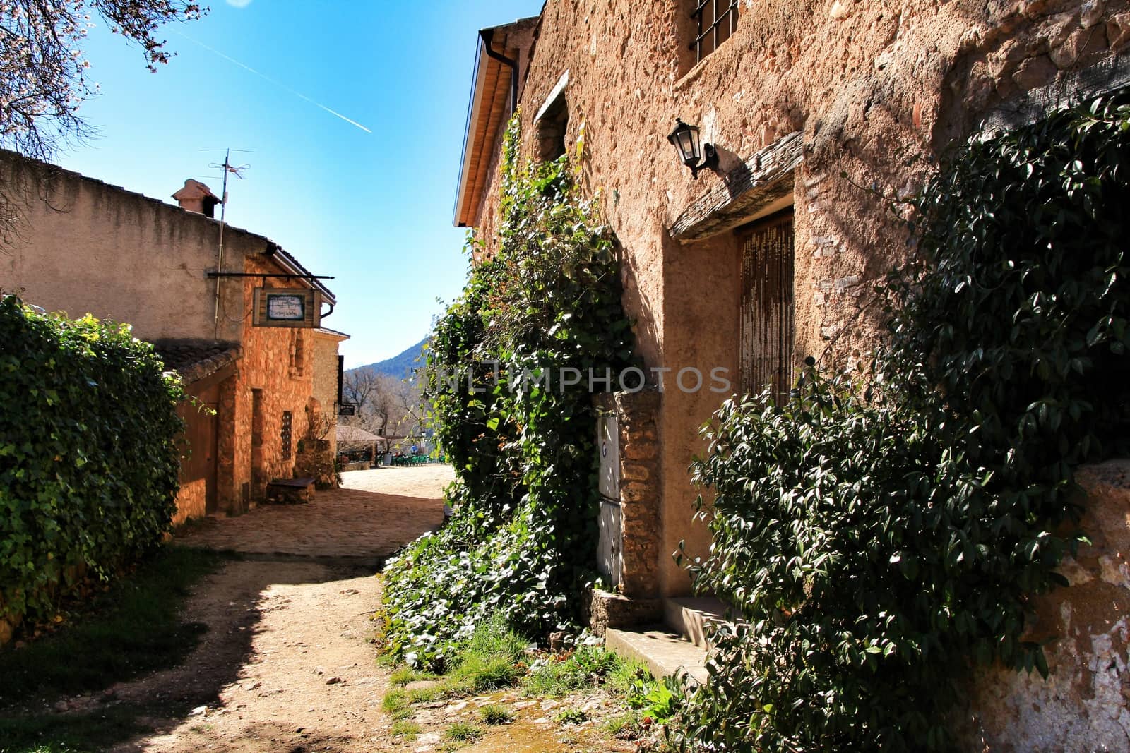 Riopar Viejo, Albacete, Spain- February 8, 2019: Old beautiful stone facades and streets in Riopar Viejo village, Castilla La Mancha, Spain. Sunny day of winter.