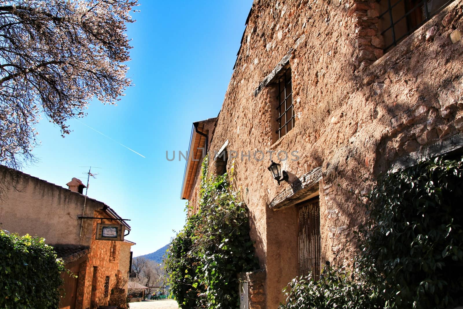 Riopar Viejo, Albacete, Spain- February 8, 2019: Old beautiful stone facades and streets in Riopar Viejo village, Castilla La Mancha, Spain. Sunny day of winter.