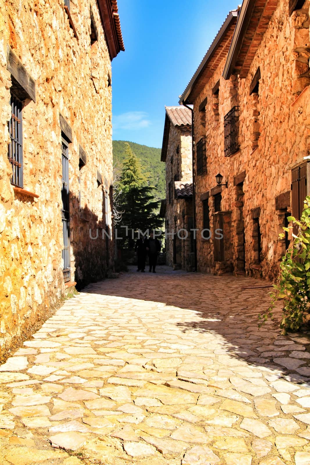 Riopar Viejo, Albacete, Spain- February 8, 2019: Old beautiful stone facades and streets in Riopar Viejo village, Castilla La Mancha, Spain. Sunny day of winter.