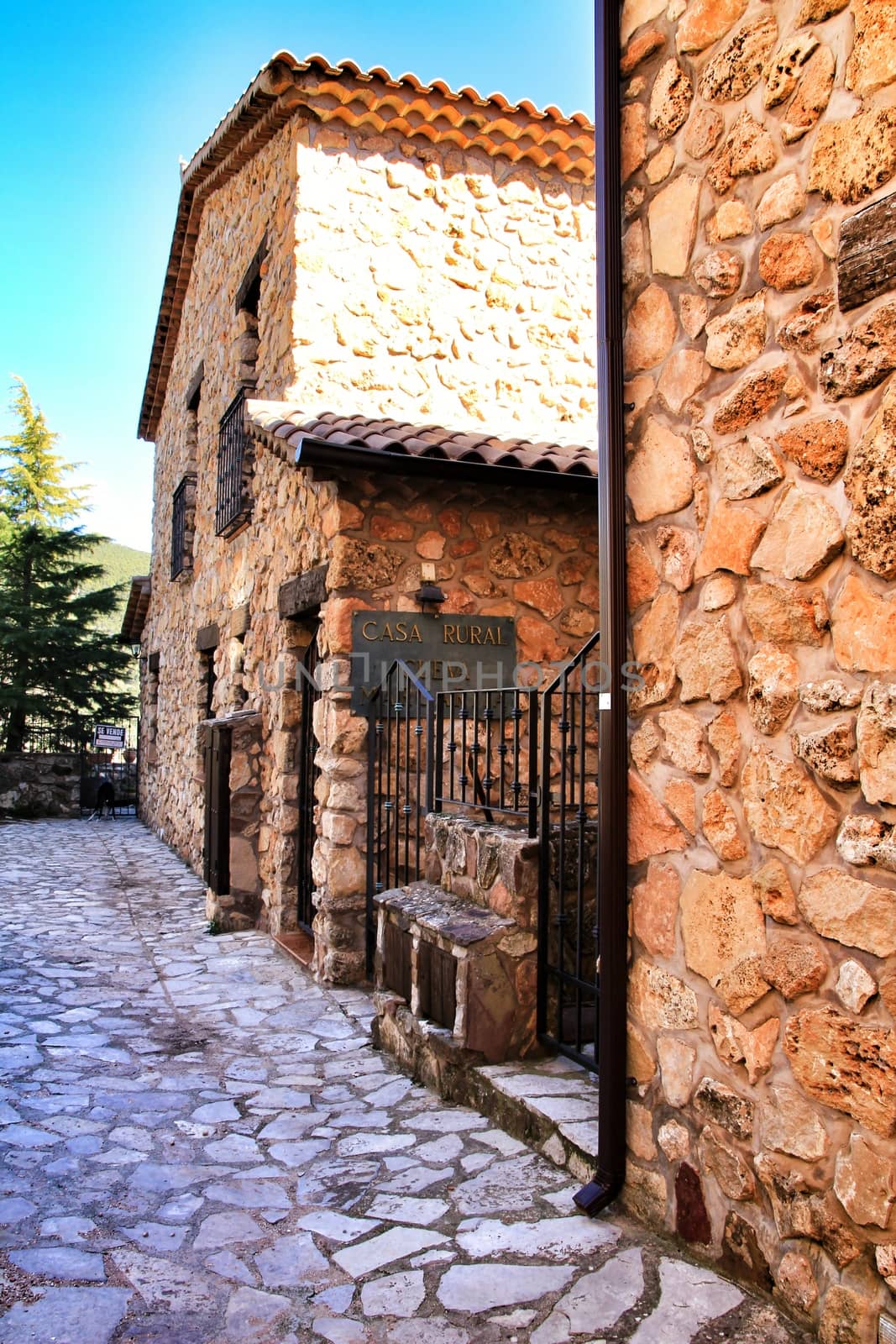 Riopar Viejo, Albacete, Spain- February 8, 2019: Old beautiful stone facades and streets in Riopar Viejo village, Castilla La Mancha, Spain. Sunny day of winter.