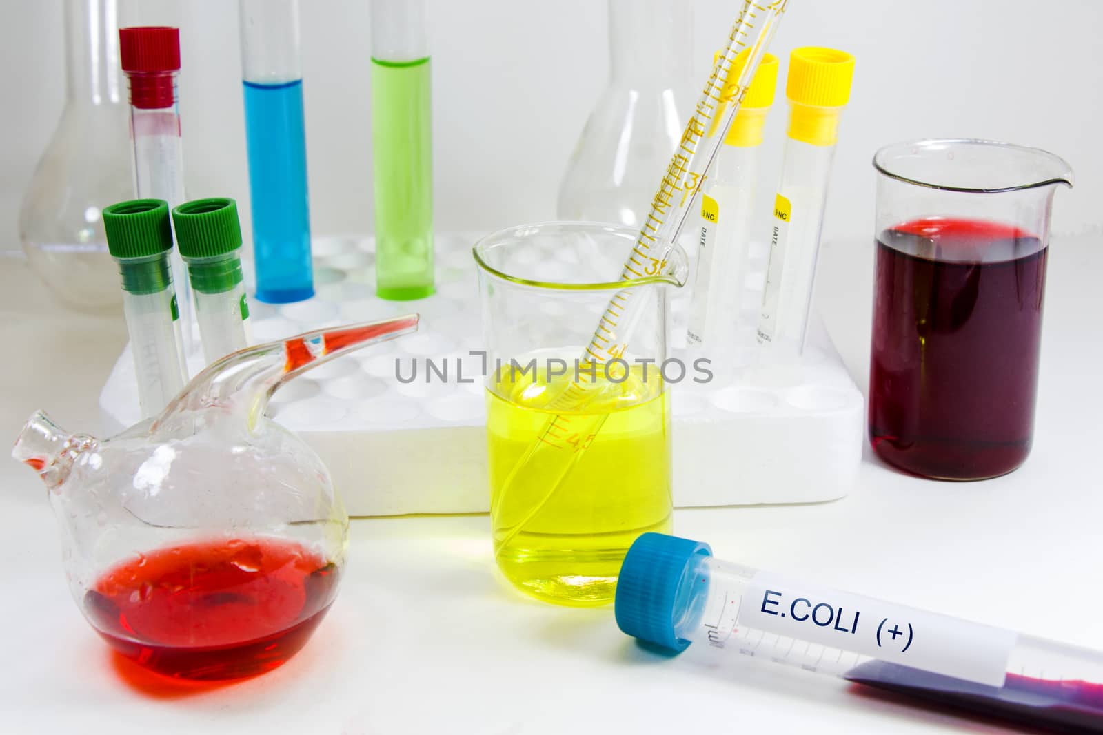 E.Coli positive blood test tube sample and laboratory instruments with chemical elements