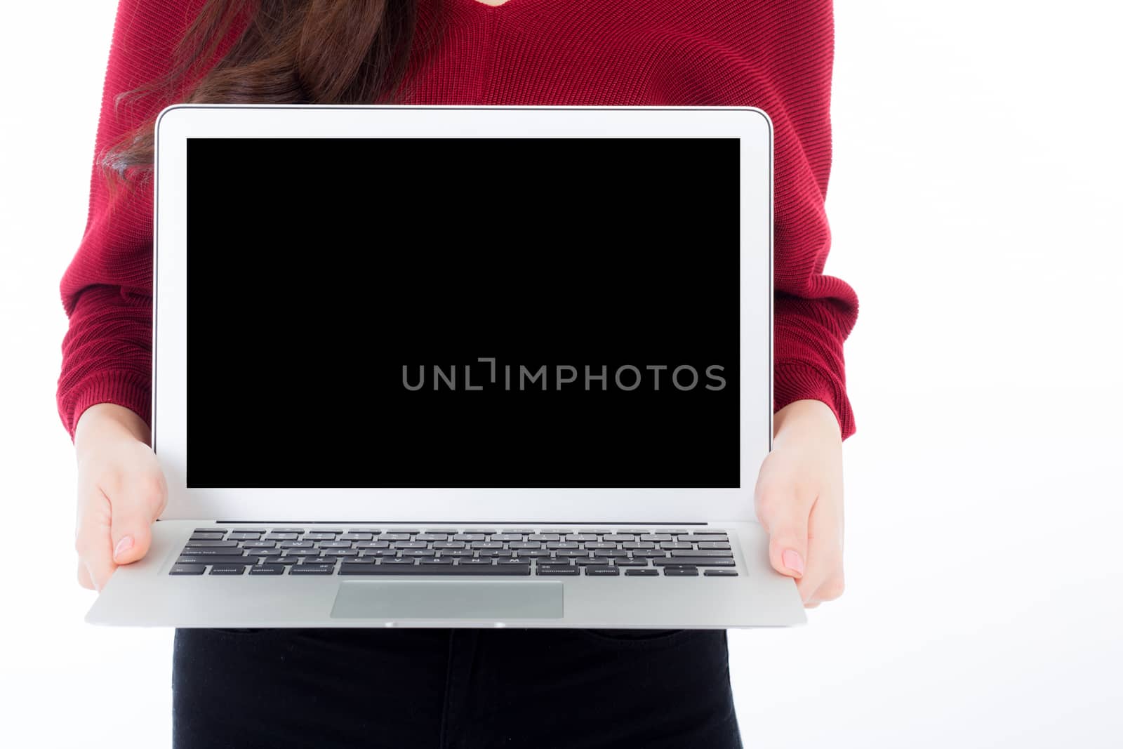 Happy businesswoman howing blank laptop or notebook screen isolated on white background.