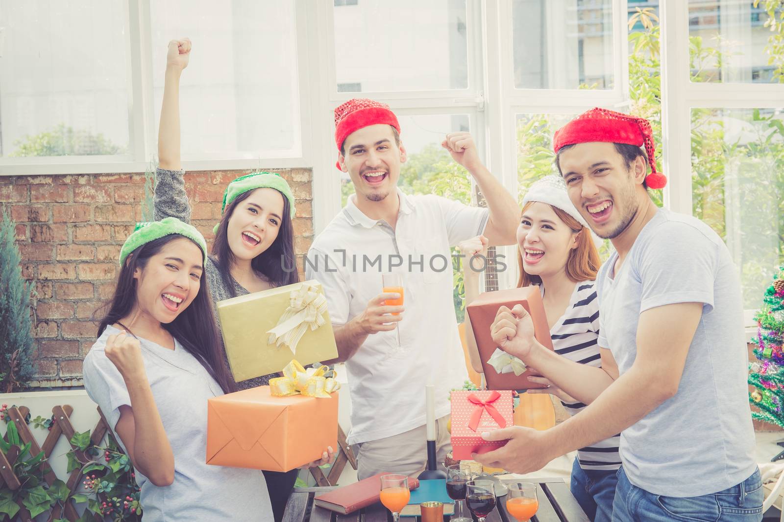Asian group people man and woman giving gift box and celebration at party outdoor. group of friends social event with birthday achievement, success festive concept.