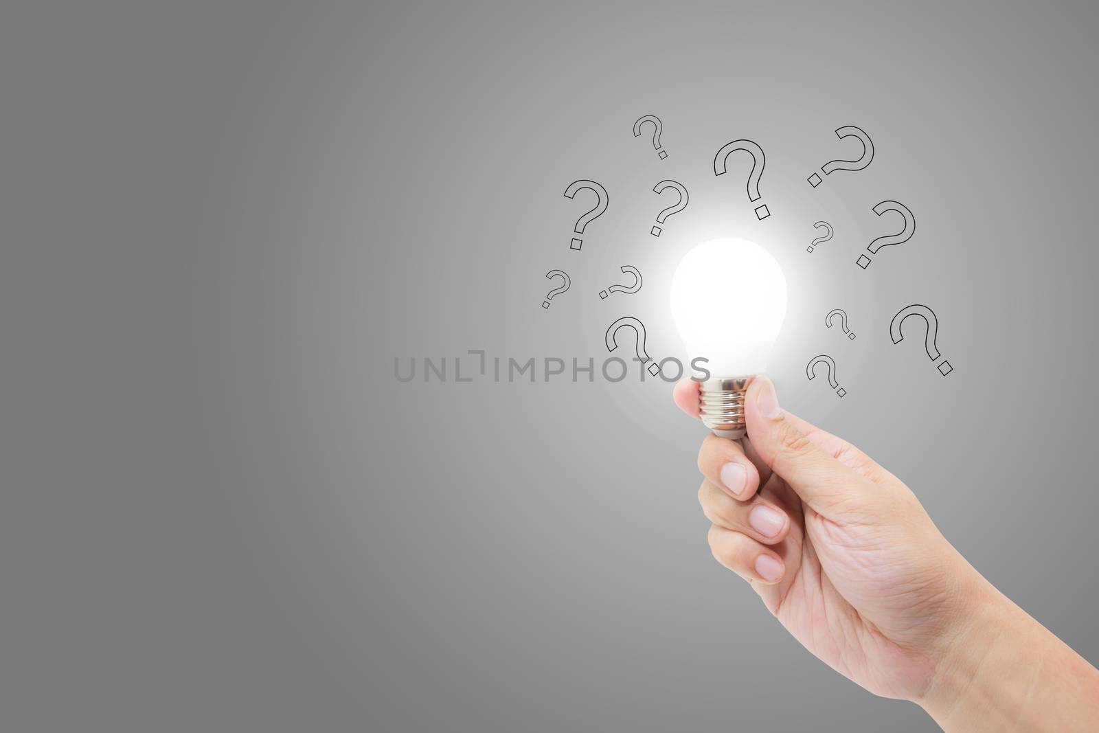 Hand with light bulb and question mark for solution, inspiration and brainstorm, problum and analysis, new idea and imagination of success concept.