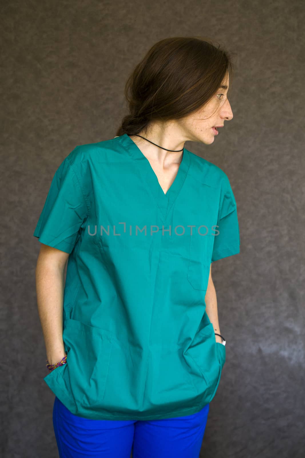 Woman portrait in medical nurse and doctors uniform by Taidundua