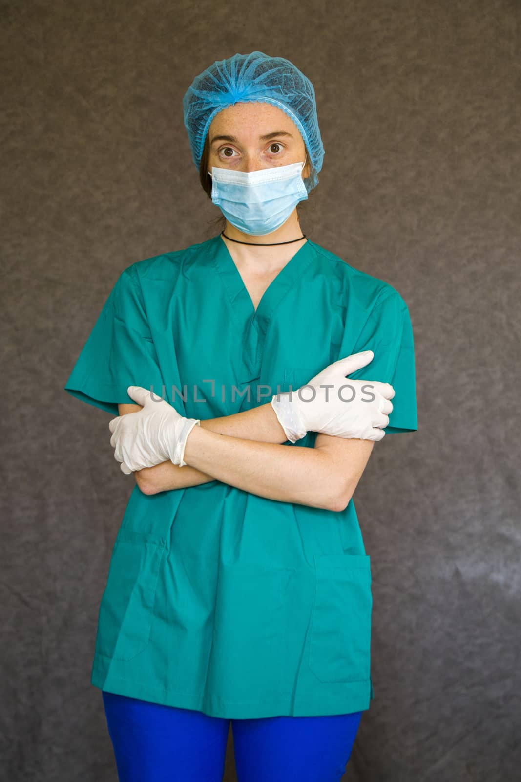 Woman doctors portrait, doctors with mask, glove and uniform. Uniform for surgery and viruses.