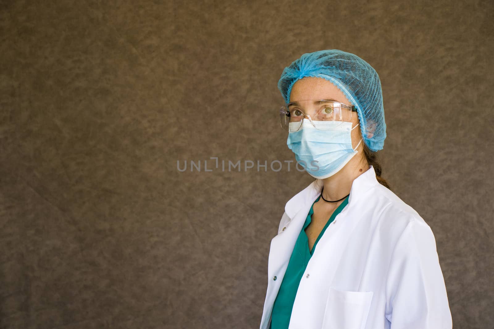 Woman doctors portrait, doctors with mask, glasses, glove and uniform. Uniform for surgery and pandemic.