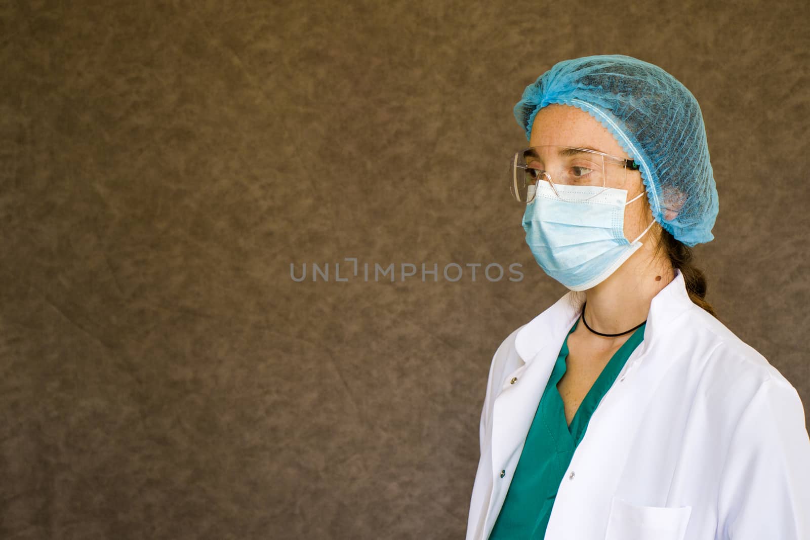 Woman doctors portrait, doctors with mask, glasses, glove and uniform. Uniform for surgery and pandemic.