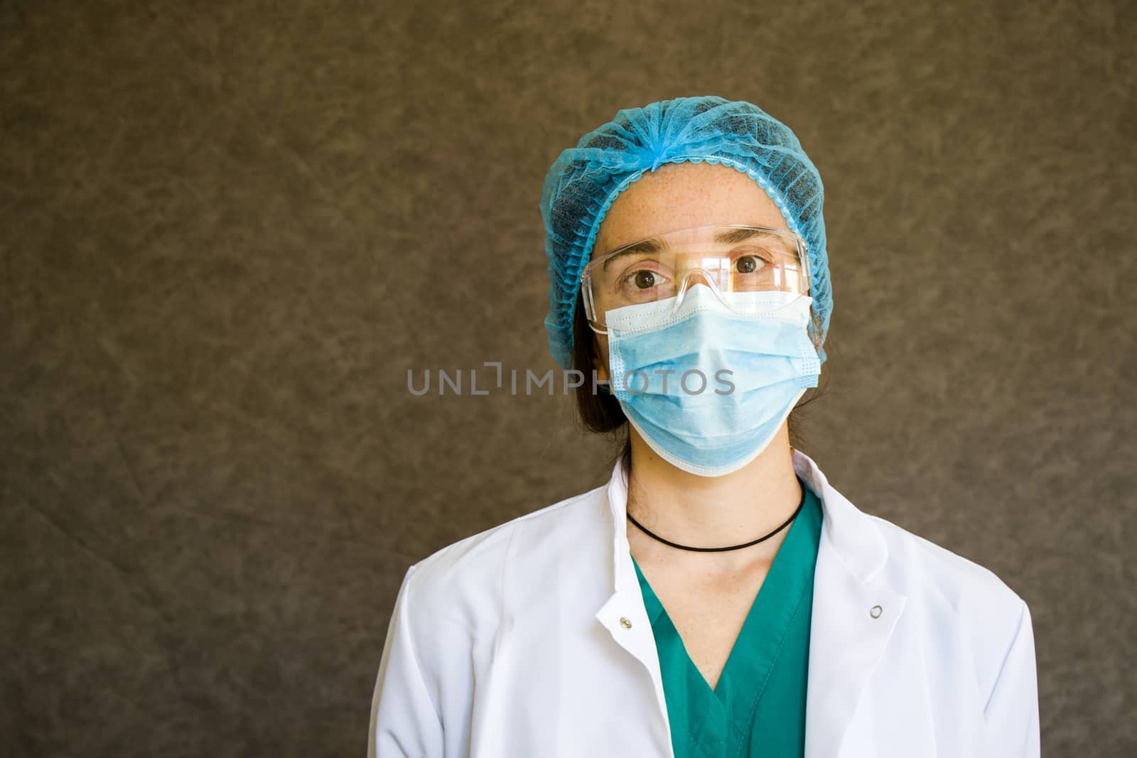 Woman doctors portrait, doctors with mask, glasses, glove and uniform. Uniform for surgery and pandemic.