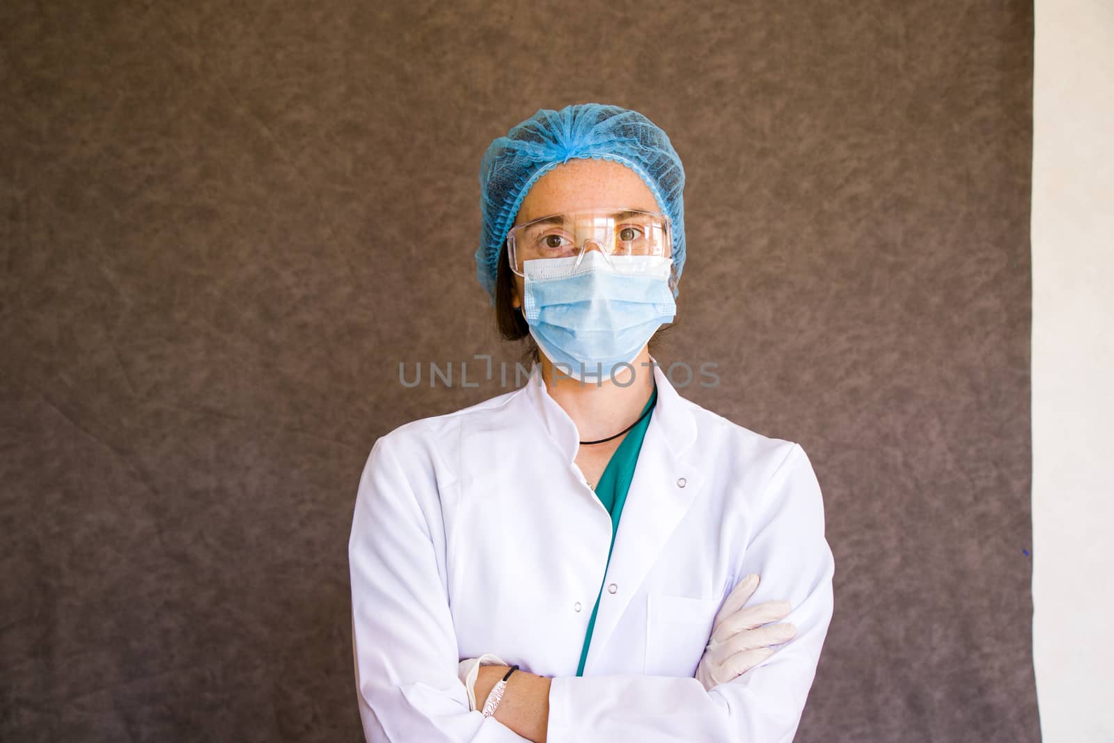 Woman doctors portrait, doctors with mask, glasses, glove and uniform. Uniform for surgery and pandemic.