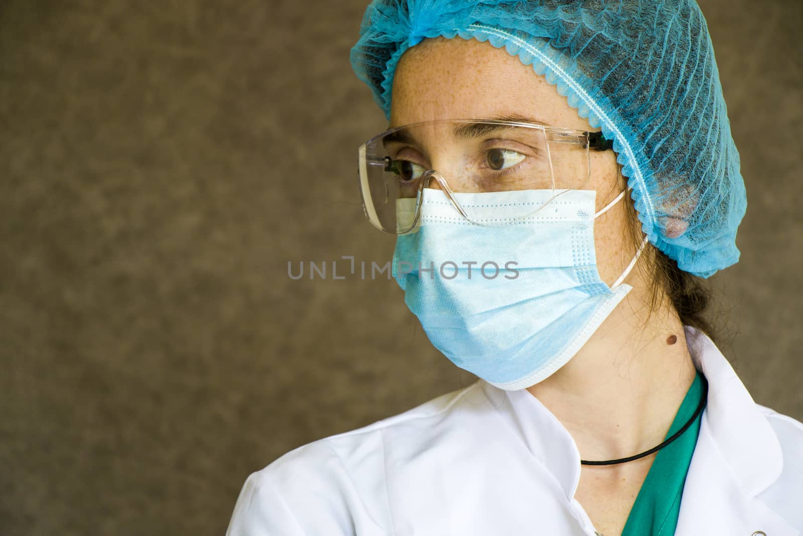 Woman doctors portrait, doctors with mask, glasses, glove and uniform. Uniform for surgery and pandemic.