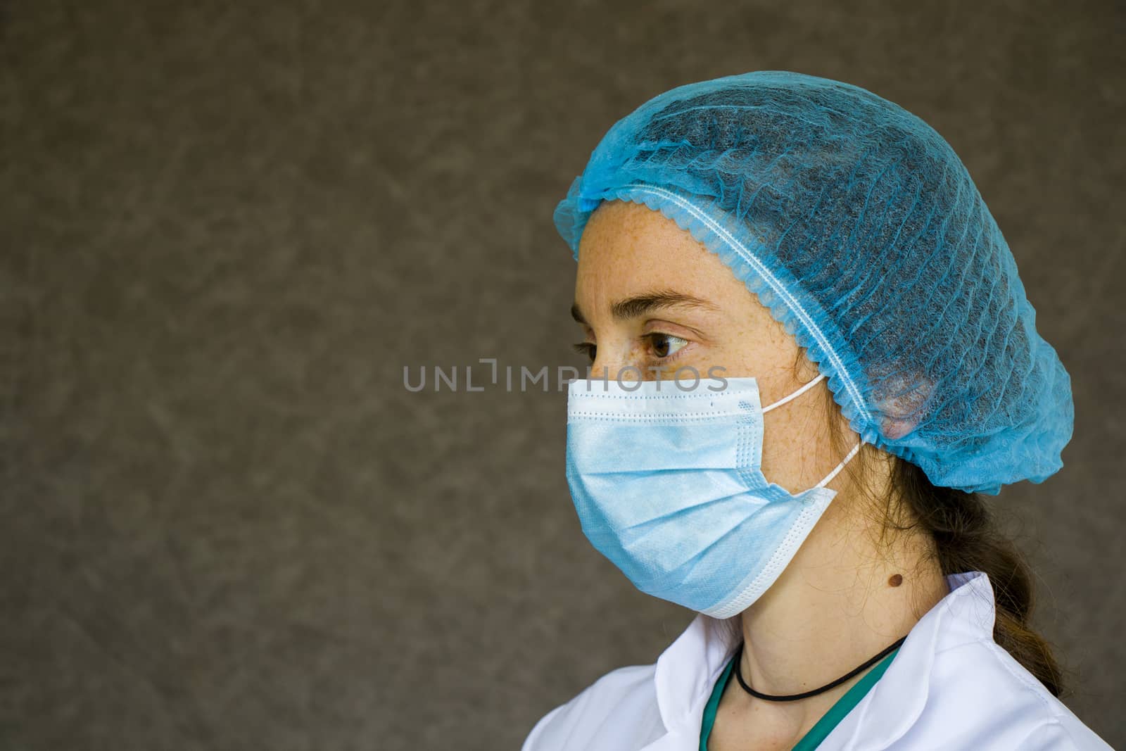 Doctor or nurse form, woman portrait in medical uniform, mask, glove and surgical cap by Taidundua