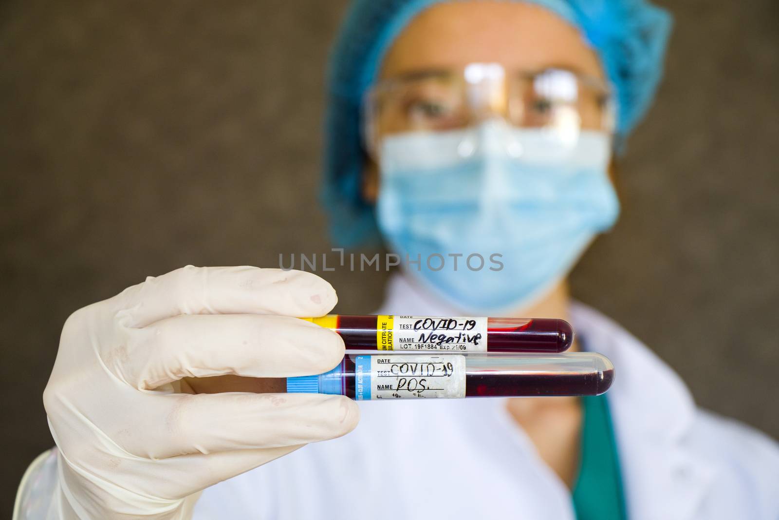 Corona virus negative and negative test samples. Doctors head and hand with glove. Studio shoot, white background.