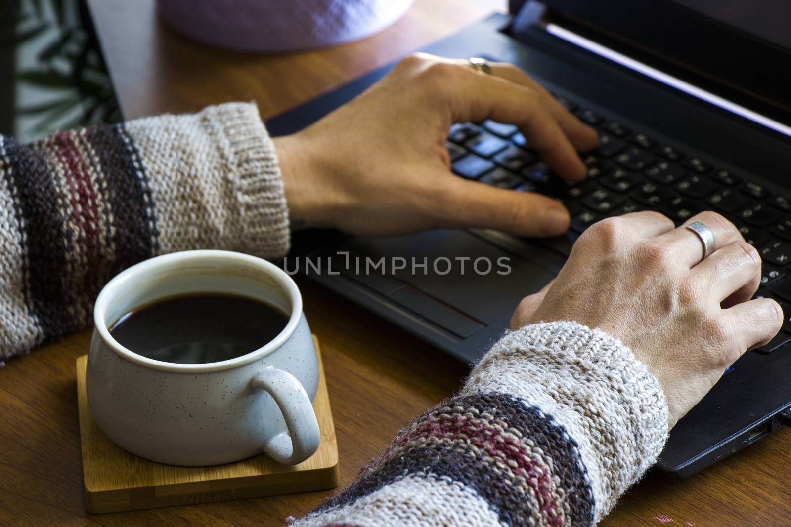 Working process, workspace and workspace, hand, coffee and notebook or laptop by Taidundua