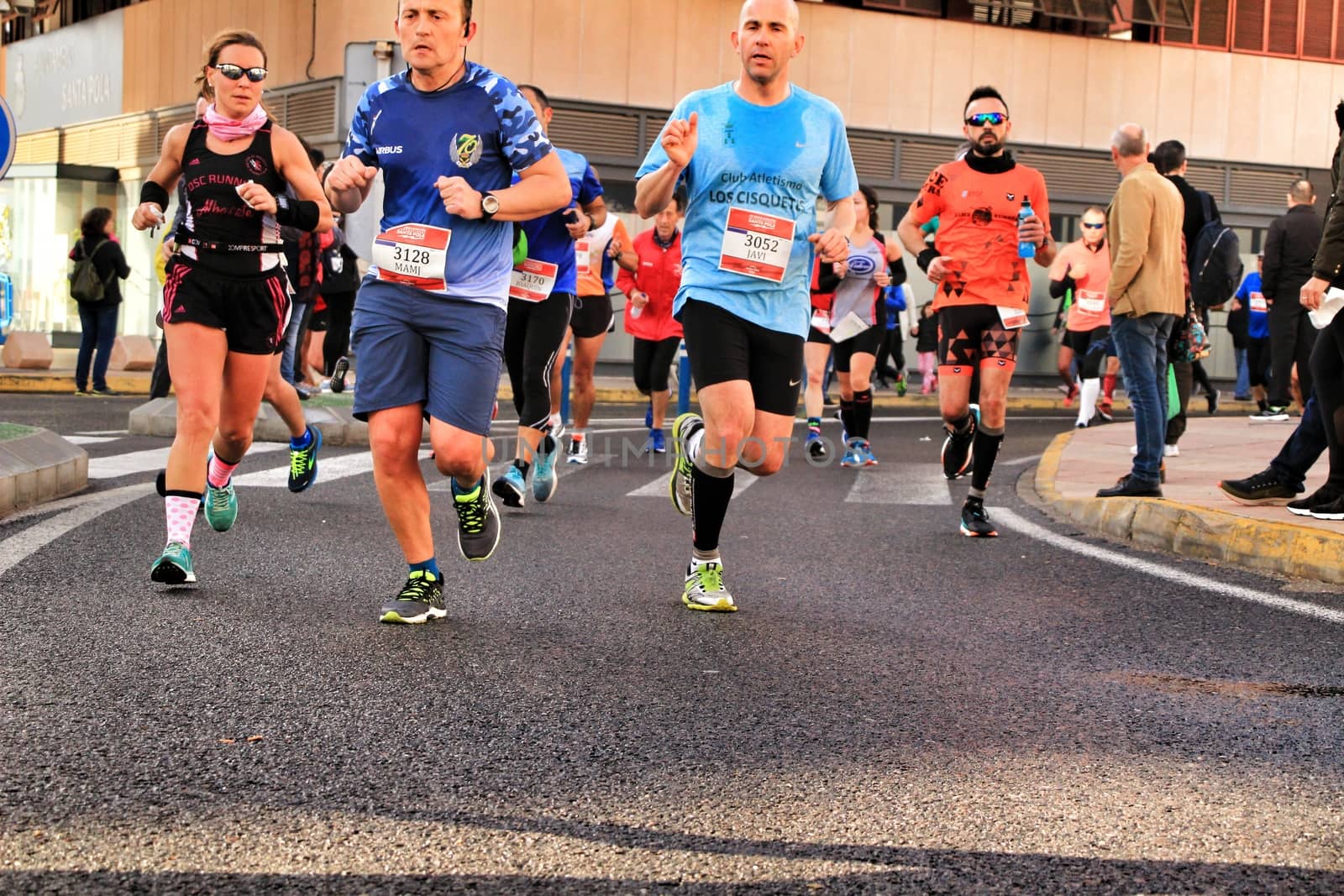 Santa Pola, Spain- January 20, 2019: Runners in the Half Marathon of the fishing village of Santa Pola, province of Alicante, on a sunny day in January