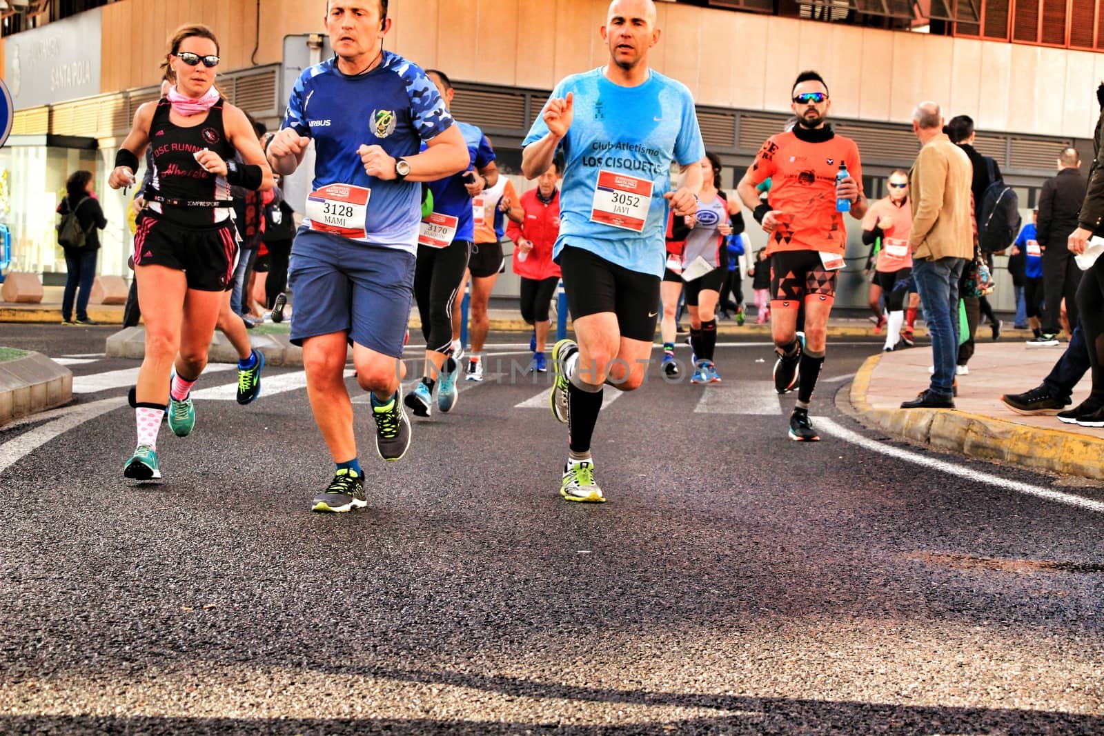 Santa Pola, Spain- January 20, 2019: Runners in the Half Marathon of the fishing village of Santa Pola, province of Alicante, on a sunny day in January