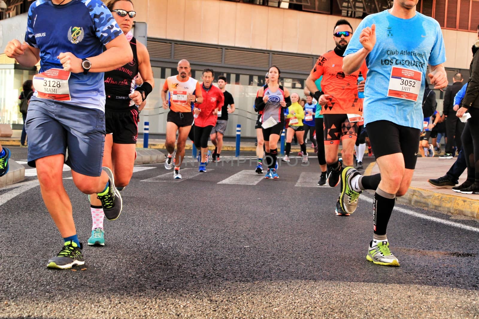 Santa Pola, Spain- January 20, 2019: Runners in the Half Marathon of the fishing village of Santa Pola, province of Alicante, on a sunny day in January