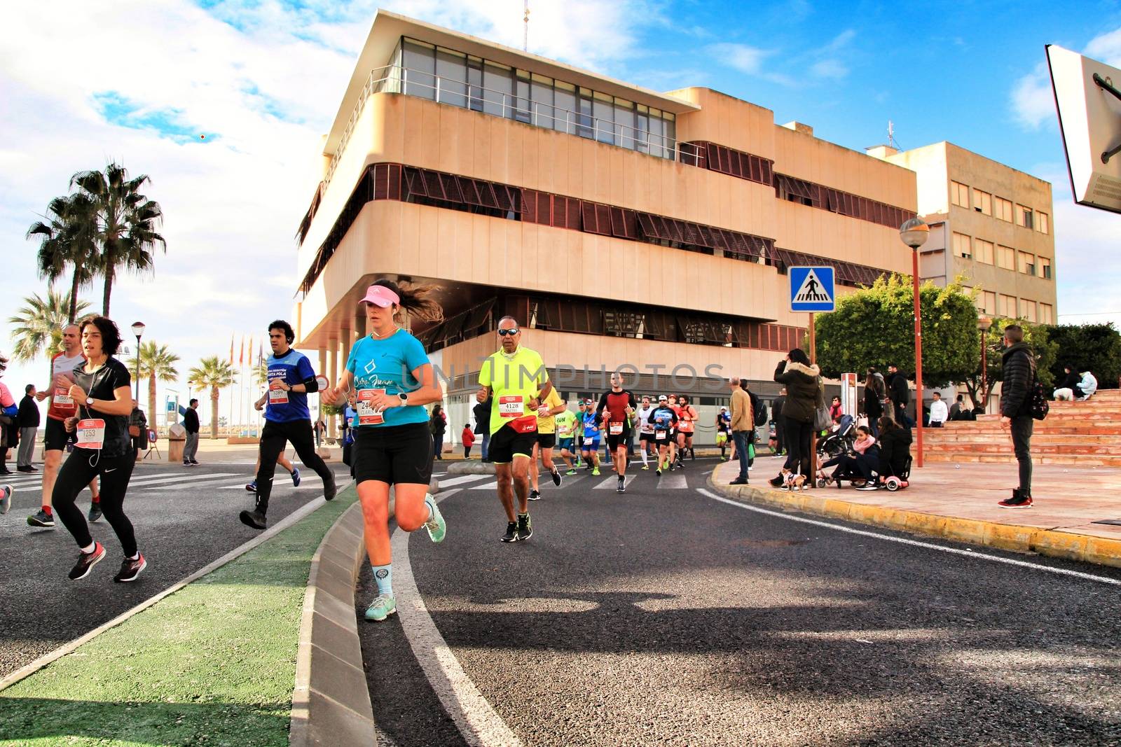 Santa Pola, Spain- January 20, 2019: Runners in the Half Marathon of the fishing village of Santa Pola, province of Alicante, on a sunny day in January