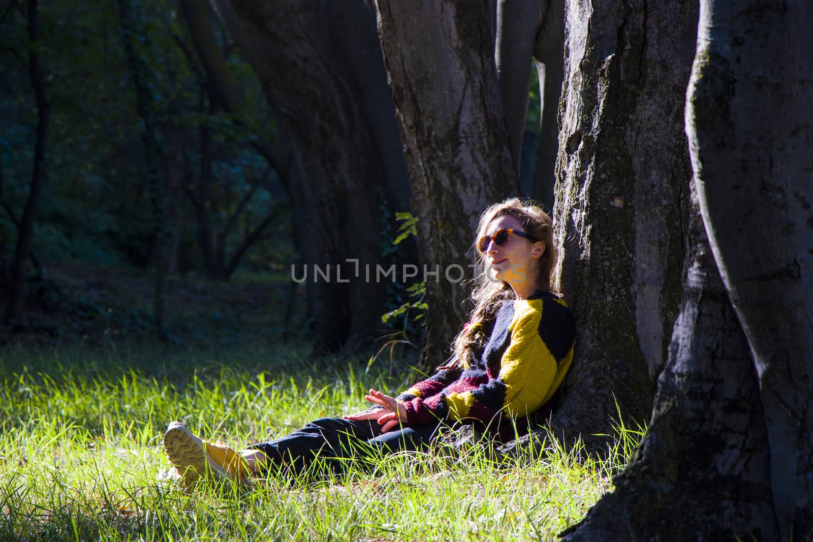 Woman in the botanic garden and park, trees and casual young girl portrait by Taidundua