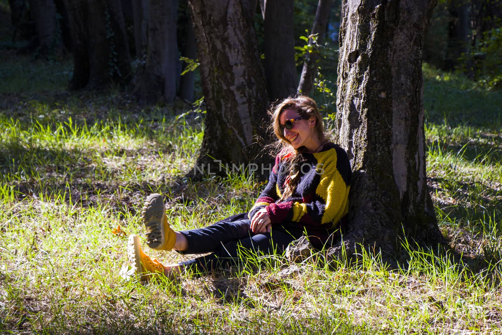 Woman in the botanic garden and park, trees and casual young girl portrait by Taidundua