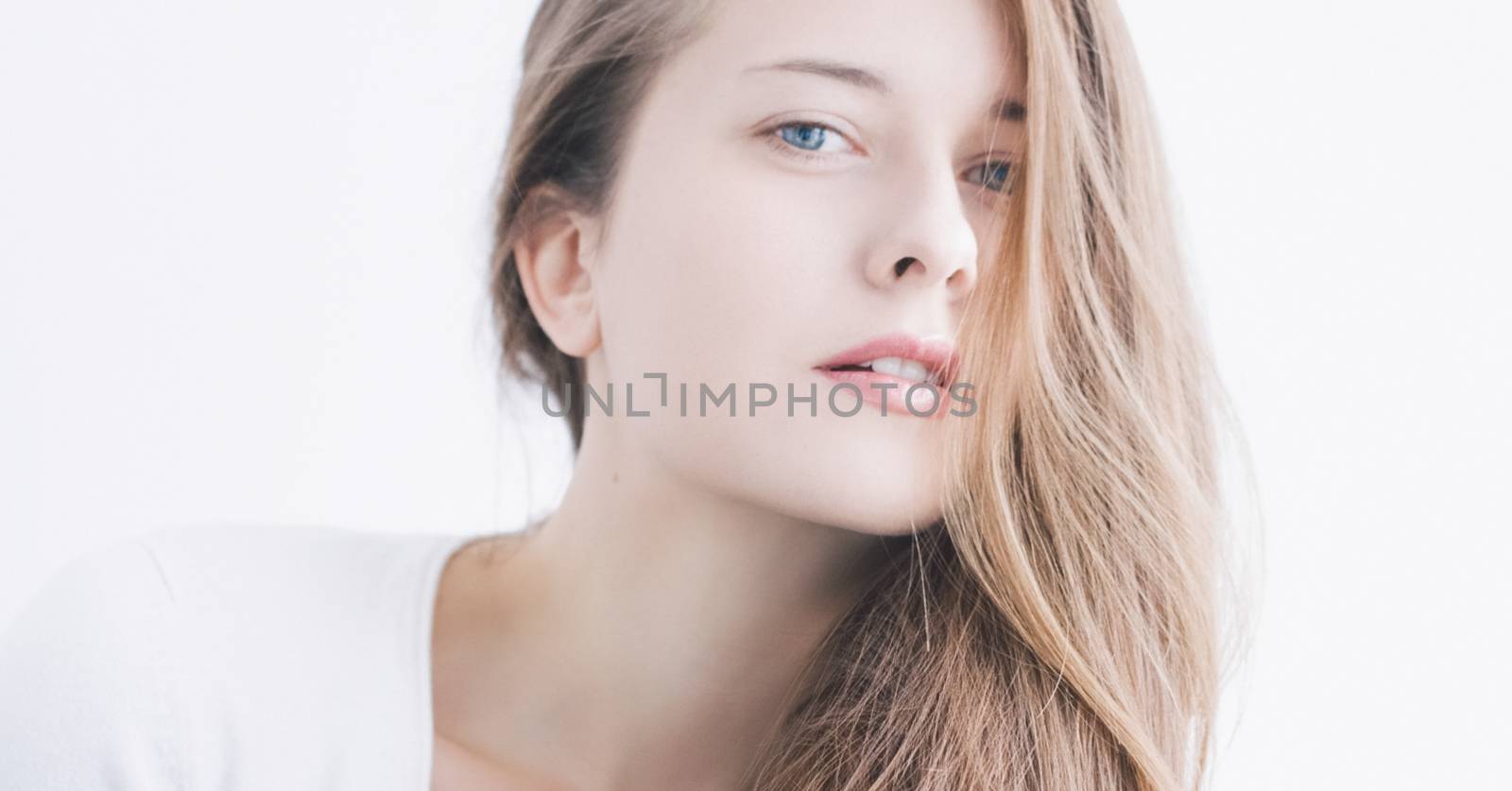 Beauty face portrait of a young woman, natural makeup look, skincare and hair care brand