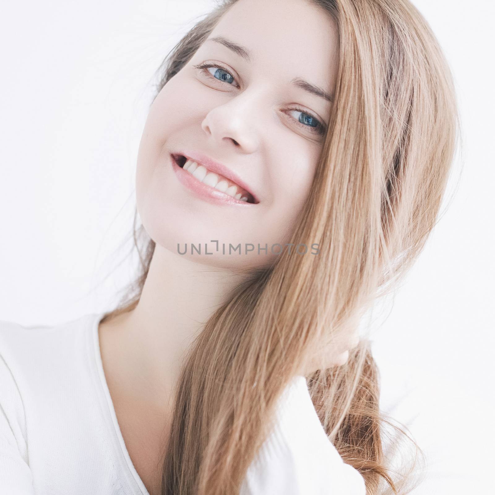 Beauty face portrait of a young woman, natural makeup look, skincare and hair care brand