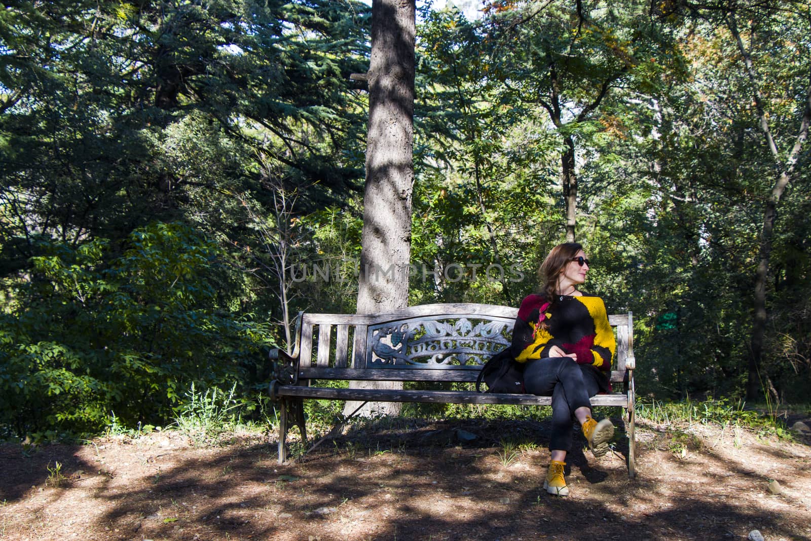 Woman in the botanic garden and park, trees and casual young girl portrait by Taidundua