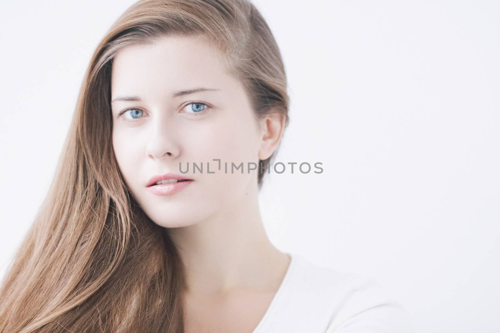 Beauty face portrait of a young woman, natural makeup look, skincare and hair care brand