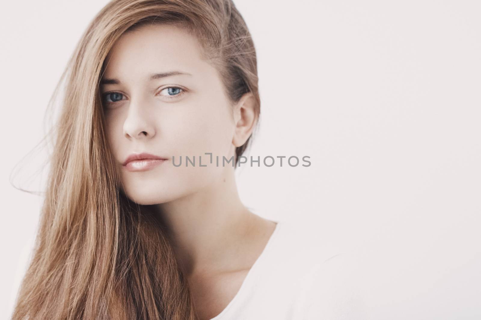 Beauty face portrait of a young woman, natural makeup look, skincare and hair care brand