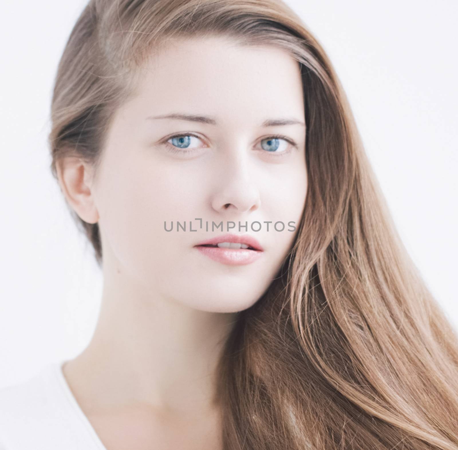 Beauty face portrait of a young woman, natural makeup look, skincare and hair care brand