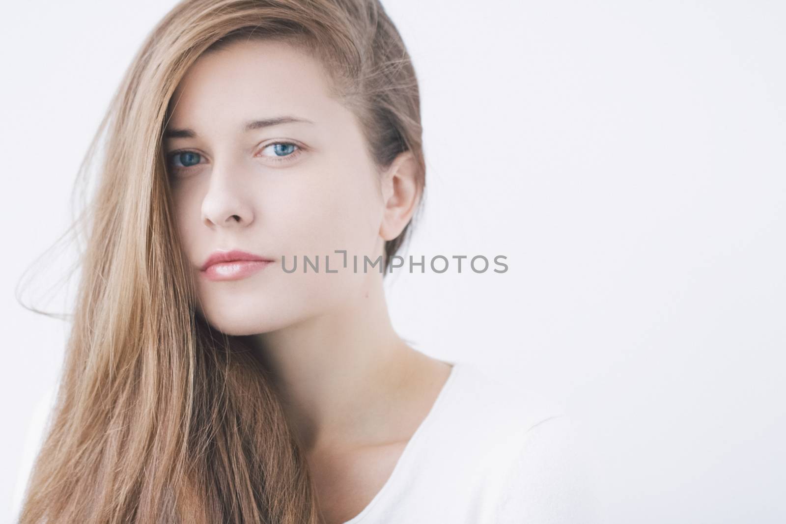 Beauty face portrait of a young woman, natural makeup look, skincare and hair care brand
