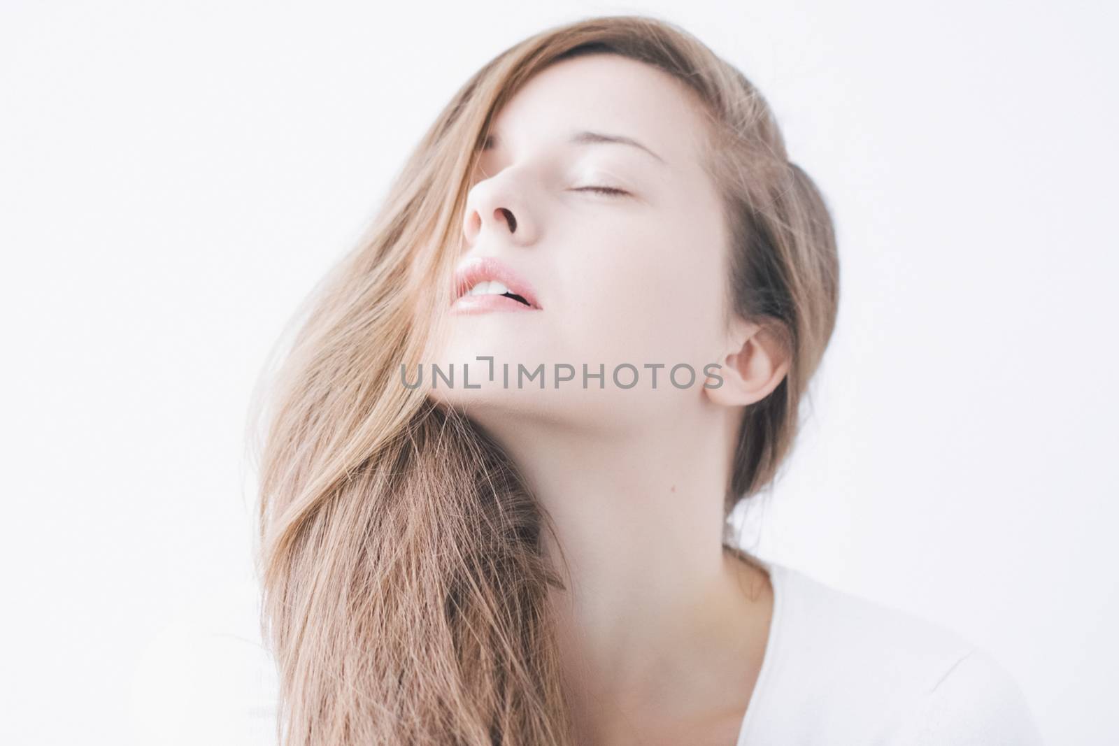 Beauty face portrait of a young woman, natural makeup look, skincare and hair care brand