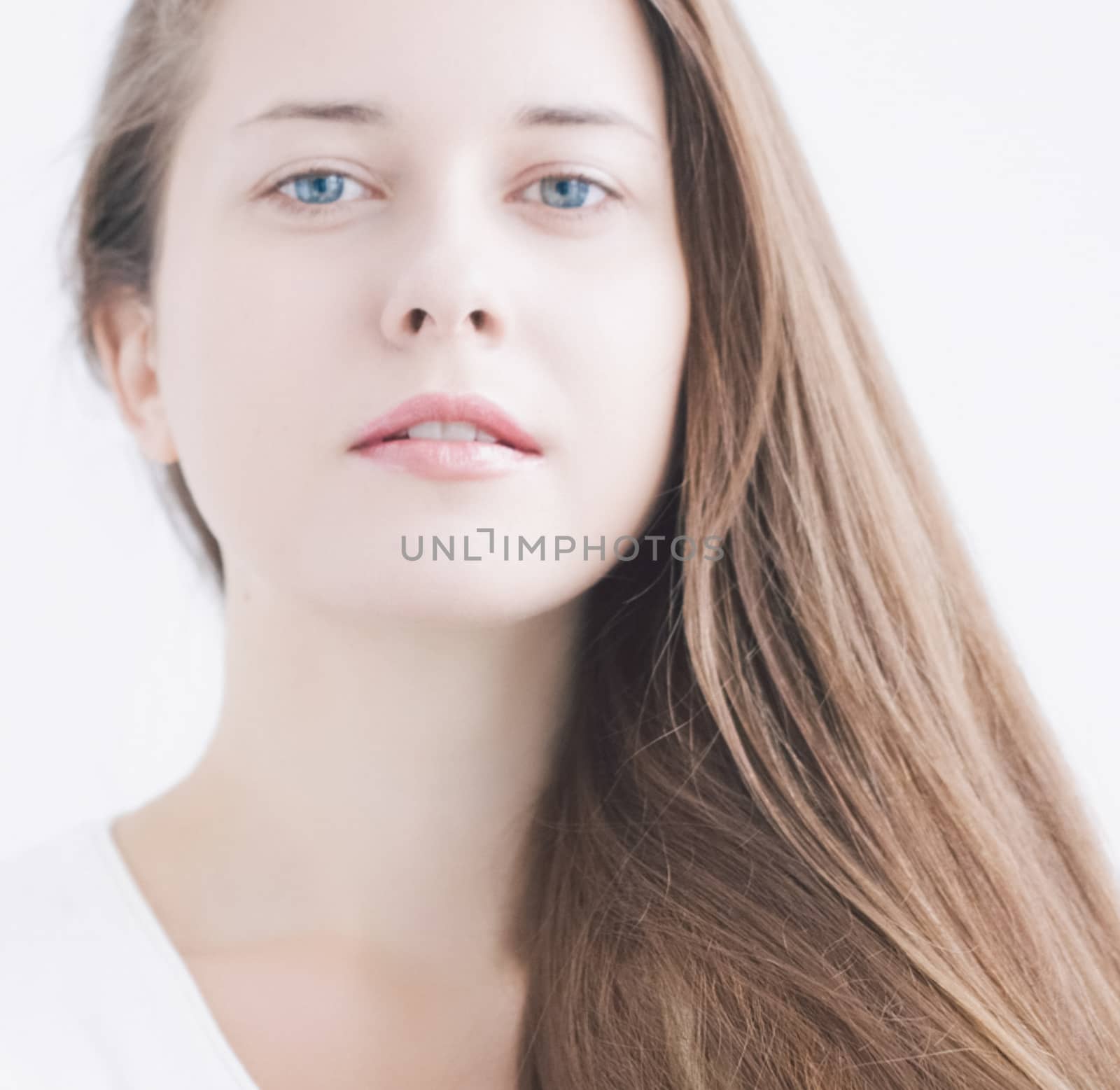 Beauty face portrait of a young woman, natural makeup look, skincare and hair care brand