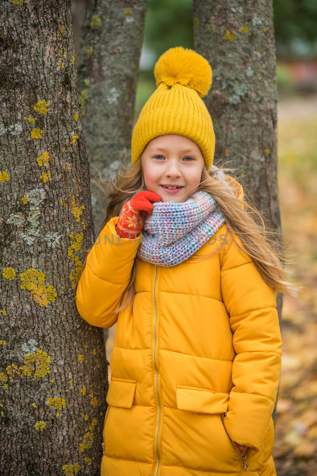 Little girl with blond hair in autumn background by infinityyy