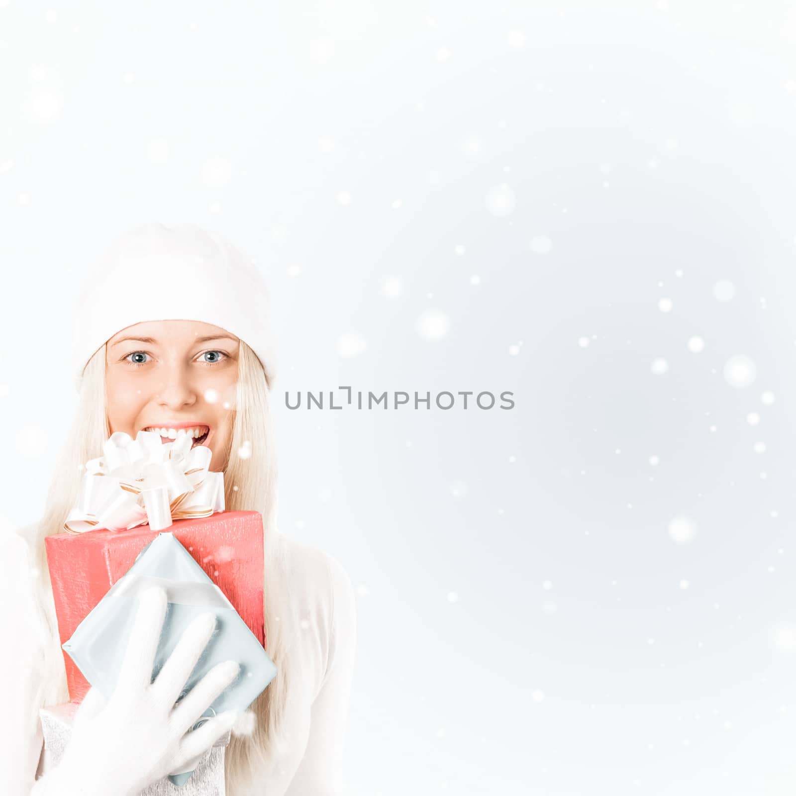 Happy woman holding Christmas gifts, silver background and snow  by Anneleven