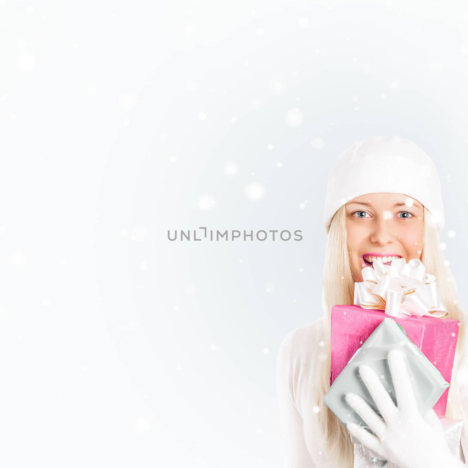 Happy woman holding Christmas gifts, silver background and snow glitter with copyspace, shopping and holidays