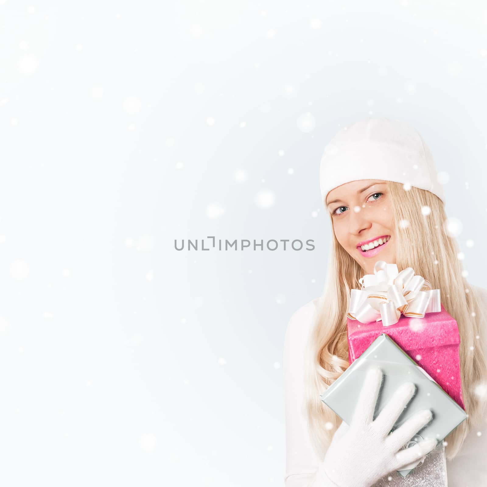 Happy woman holding Christmas gifts, silver background and snow  by Anneleven