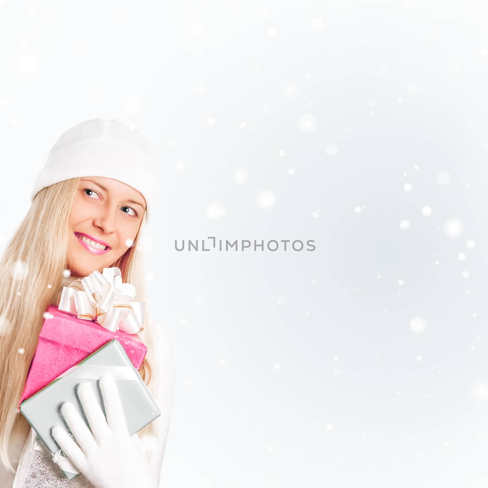 Happy woman holding Christmas gifts, silver background and snow  by Anneleven