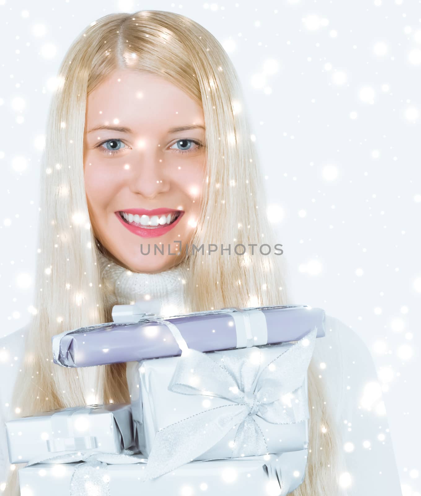 Happy woman holding Christmas gifts, silver background and snow  by Anneleven