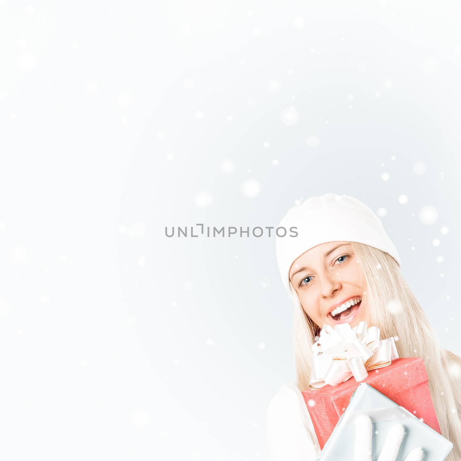 Happy woman holding Christmas gifts, silver background and snow  by Anneleven